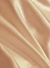 Close-up of smooth, beige fabric with folds